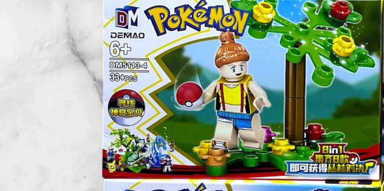Figura armable de entrenadora Pokémon con pokebola y árbol, set DEMAO DM5113-4 de 33 piezas